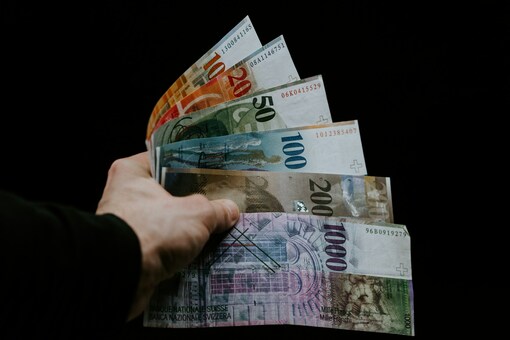 Hand holding foreign banknotes